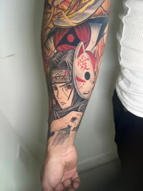 Inner-arm view of the same anime sleeve, the fox mask and the shinobi portrait read from below