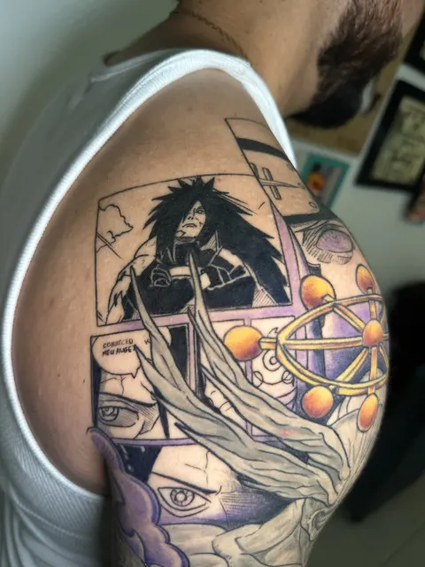 Anime shoulder view where inked manga panels frame a long-haired warrior in black and white