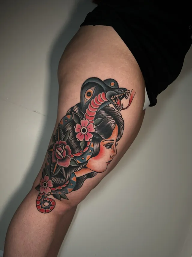 Traditional tattoo portrait of a woman intertwined with a serpent